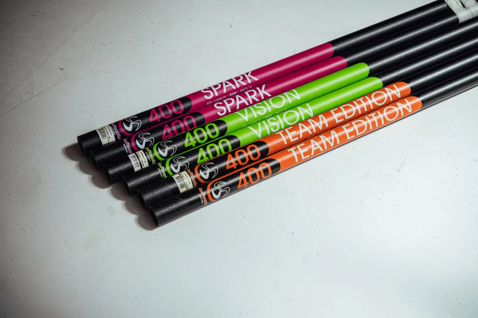 Loftsails windsurf masts—Spark, Vision, and Team Edition models color-coded and arranged side by side.